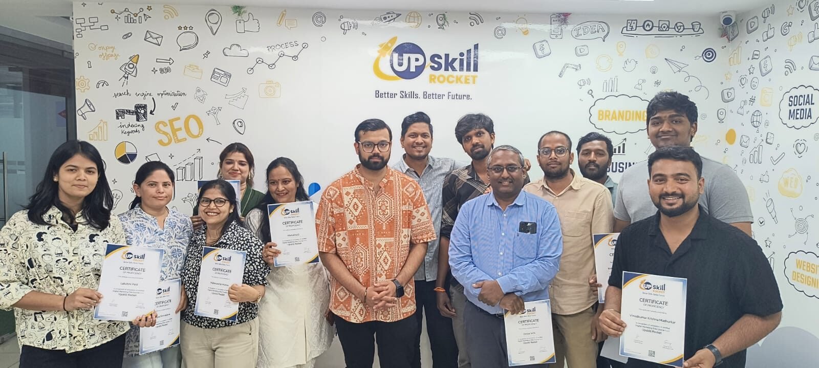 A training batch holding their completion certificates